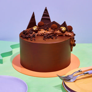 Chocolate cake with decorative elements on a colorful background