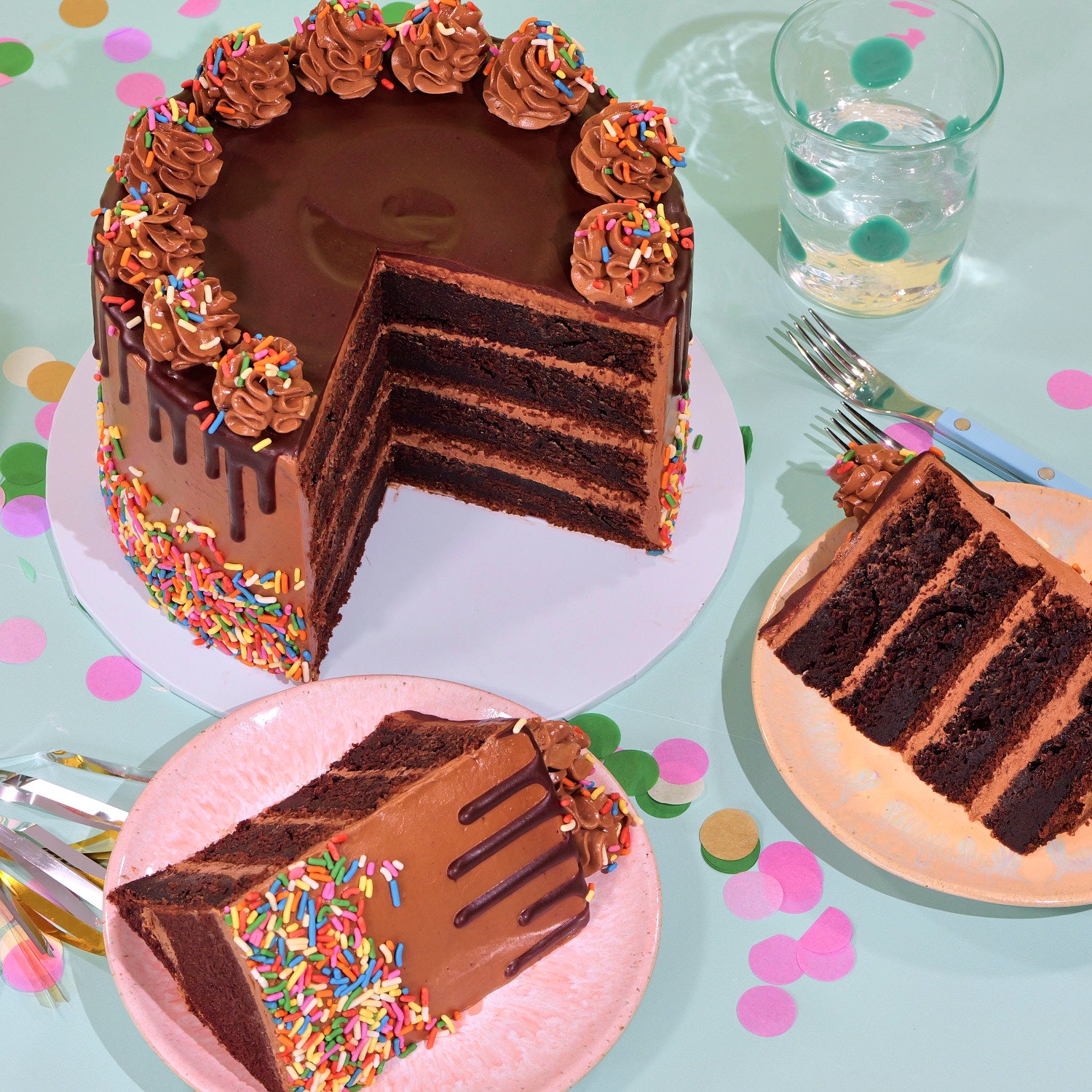 Chocolate Birthday Cake by Crumbs & Doilies with rich layers, chocolate drip, piped icing, and colorful sprinkles decoration