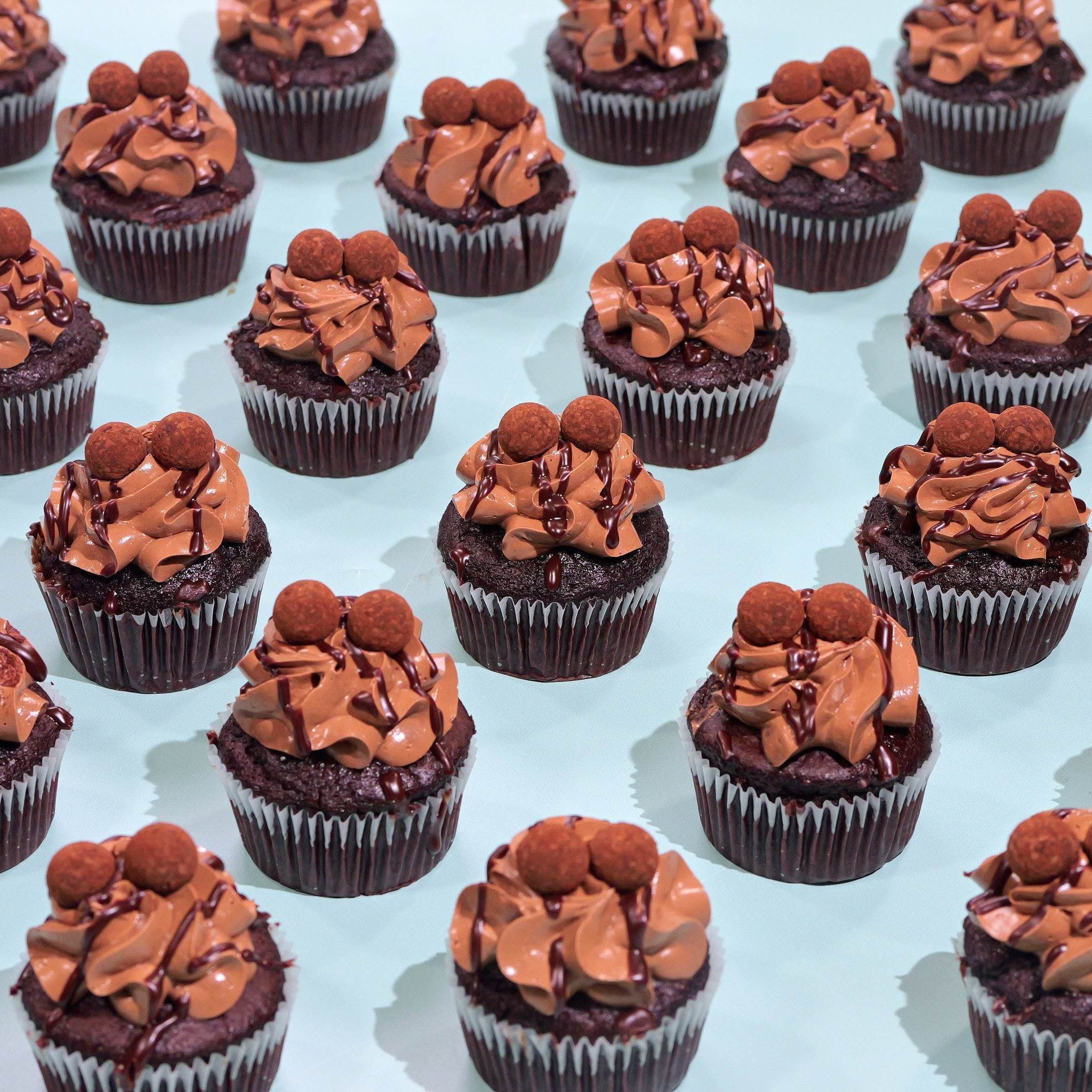 Chocolate Cupcakes with rich chocolate Swiss meringue buttercream and ganache drizzle by Crumbs & Doilies