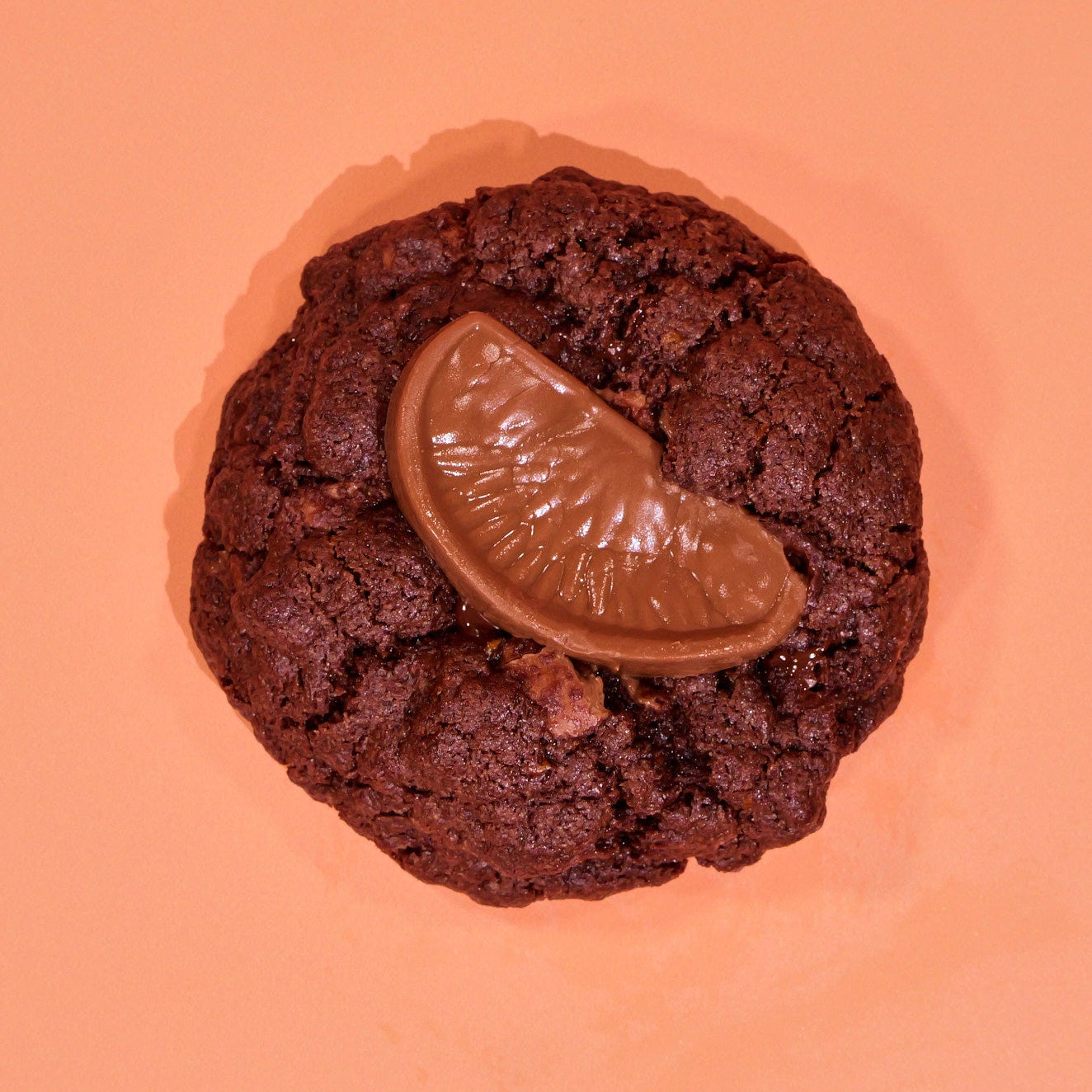 Terry's Chocolate Orange New York Cookie with milk chocolate chip dough and a chocolate orange segment topping Crumbs & Doilies