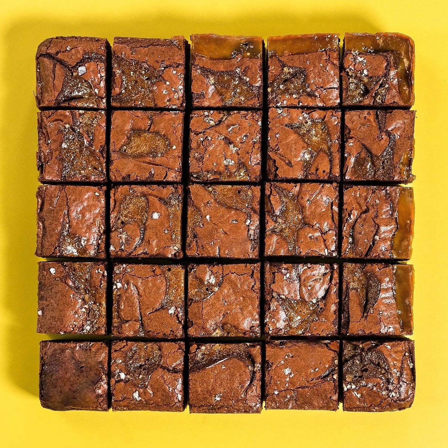 Salted Caramel Brownie with fudgy base, caramel swirls, and sea salt sprinkle by Crumbs & Doilies